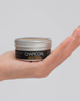 exfoliating face scrub pollution detox charcoal coconut bodia apothecary in hand